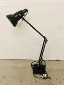 A black angle poise desk lamp by Herbert Terry and Sons ltd