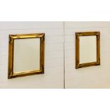 A pair of ornate gilt framed bevelled mirrors (54cm x 65cm)
