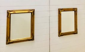 A pair of ornate gilt framed bevelled mirrors (54cm x 65cm)