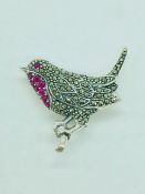A silver robin brooch inset with marcasites