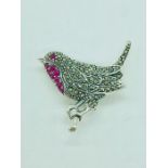 A silver robin brooch inset with marcasites