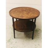 An Oval two tier table with bentwood legs in art and crafts style