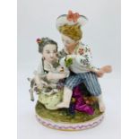 An 18th century Meissen figure of children with a lamb