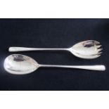 A Pair of silver salad servers, hallmarked London 1936 by EP & S.