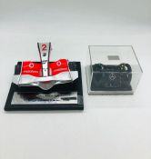 Mercedes racing promotional items to include a Vodaphone MP4-22A nose cone AF and a miniature