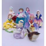 Seven small Royal Doulton figurines and a small china bird