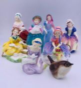 Seven small Royal Doulton figurines and a small china bird