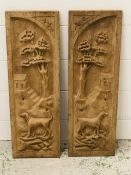 A pair of carved wooden panels (55cm x 18cm)