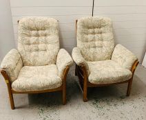 A Pair of mid century Ercol easy chairs