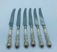 A set of six silver handled knives, makers mark HB (Possibly Harrison Brothers Sheffield 1965)