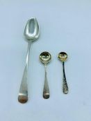 A silver teaspoon and two silver mustard spoons