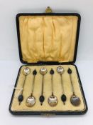 A cased set of silver berry spoons
