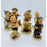 A selection of seven Hummel figures