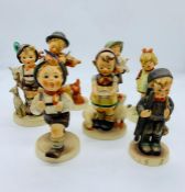 A selection of seven Hummel figures