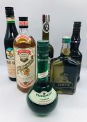 A selection of six bottles to include a Fernet-Branca Diqestif, Crème de Menthe Sebar Absinth, a