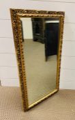 A gilt framed bevelled mirror