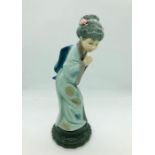 A Lladro figure of a oriental lady marked Daisa 1976 to base