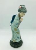 A Lladro figure of a oriental lady marked Daisa 1976 to base