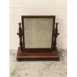 A dressing table free standing mirror