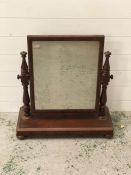 A dressing table free standing mirror