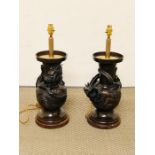 A Pair of Meji period bronze vases with lamp base conversion.