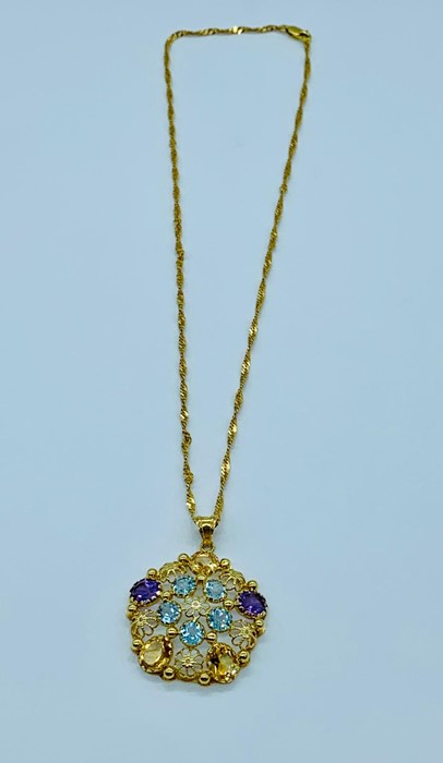 A pendant with semi precious stones to include amethyst, citrine and aquamarine, marked 750 on a - Image 2 of 2