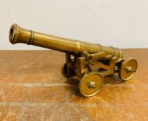 A Mid 19th century brass standing carriage and cannon