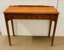 A walnut two drawer console table (H75cm W88cm D32cm)