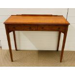 A walnut two drawer console table (H75cm W88cm D32cm)