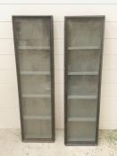 A pair of wall hanging display cases