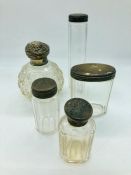 Five various silver topped dressing table glass jars