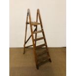 A pair of wooden step ladders