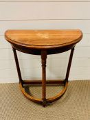 A walnut half moon console table (H67cm W60cm D30cm)