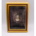 A framed miniature of a lady