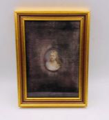 A framed miniature of a lady