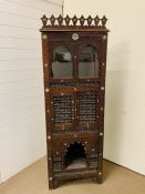 A 19th Century Islamic North African corner cabinet inlaid with Mother of Pearl (H190cm x W65cm x