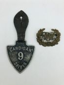 A Cardigan bus driver badge and a GWR badge