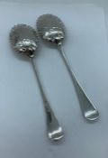 A Pair of decorated silver spoons, hallmarked 1893-94 Sheffield, makers mark HA