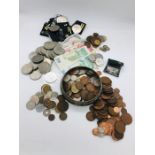 A large selection of coins and some South African and Kenyan bank notes