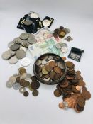 A large selection of coins and some South African and Kenyan bank notes