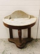 A marble topped washstand with cabriole front leg and two supporting back legs AF