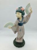 A Lladro figure of an oriental lady with two fans