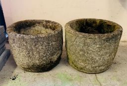 Two concrete garden pots