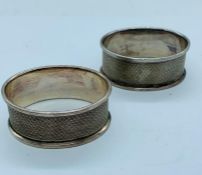 A pair of hallmarked silver napkin rings