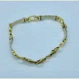 A 14ct gold bracelet in a belt style (12.36g)