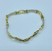 A 14ct gold bracelet in a belt style (12.36g)