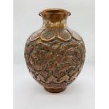A Persian Copper Vase.