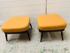 A pair of mid century Ercol footstools