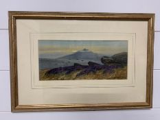 A Framed print of a mountain scene signed by Alfred Grahame