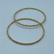 A pair of 22ct gold bracelets (16.2g)